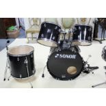 A Sonor 22” diam. kick drum; a 16" floor tom; a 13” diam. tom; a 12” diam tom; an un-named 14” diam.