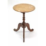A Victorian oak tripod table with vase-turned centre column & on three fluted cabriole legs, 17¼”