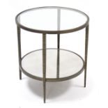 An iron circular two-tier occasional table on square tapered supports, 24” diameter x 25½” high.