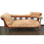A late Victorian carved walnut-frame two-seater settee, (requires reupholstering) on short ring-