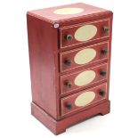 A crimson & ivory painted pine small upright chest, fitted four long drawers with turned knob