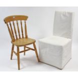 A spindle-back kitchen chair with hard seat and on turned legs with spindle stretchers; & another
