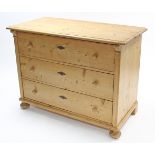 Another continental-style pine chest fitted three long graduated drawers with turned knob handles, &