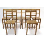 A set of six teak rail-back stacking child’s chairs.