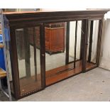 A Victorian mahogany shops display cabinet with moulded dentil cornice, with mirrored back, &