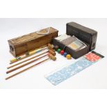 A croquet set in pine case; & various items of household textiles.