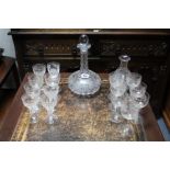 A heavy cut-glass bulbous decanter with etched vine-leaf design & with ball stopper, 10¾” high; a