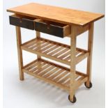 A beech kitchen island, fitted two frieze drawers above two open shelves & on square supports,