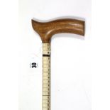 A Shark’s vertebrae walking cane with hardwood handle, 36” long.