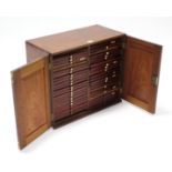 A VICTORIAN MAHOGANY COUNTER-TOP COLLECTOR’S CHEST, fitted two ranks of twenty-one sliding trays