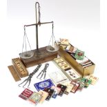 A set of apothecary’s travelling beam scales with weights; a complete set of 25 Player's Yacht Raci