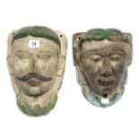 Two eastern painted & carved wooden wall masks, 10½” & 9” high.