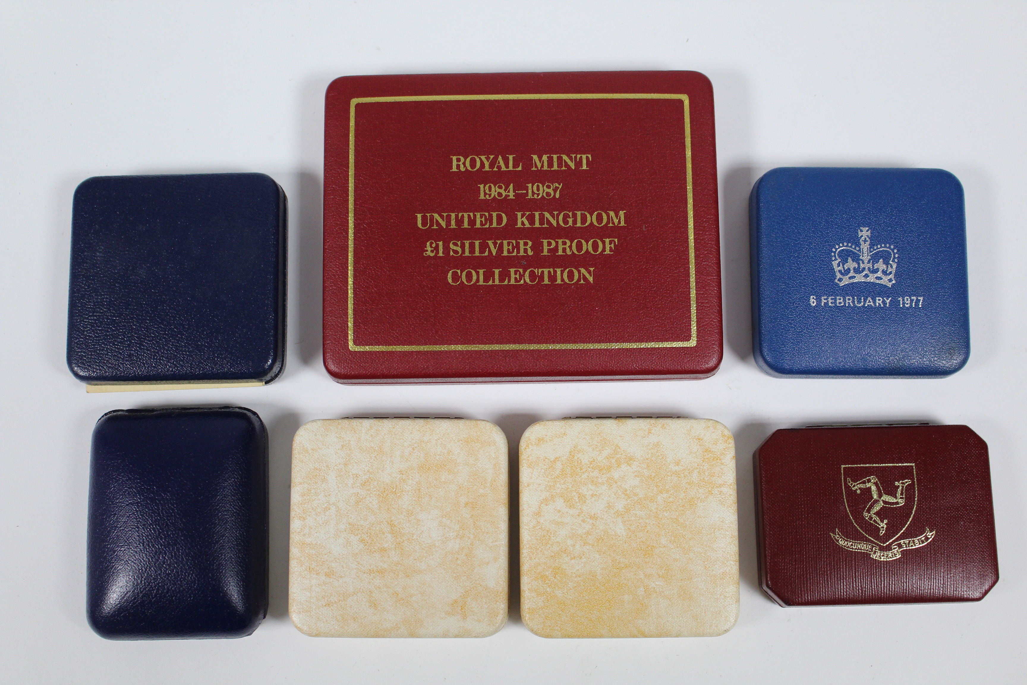 A set of four sterling silver proof £1 coins, 1984-1987, cased; a 1977 Silver Jubilee sterling - Image 2 of 2