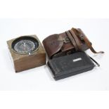 An Ensign “No.7 Carbine” folding camera with leather case; & a Silva of Stockholm Sweden boats