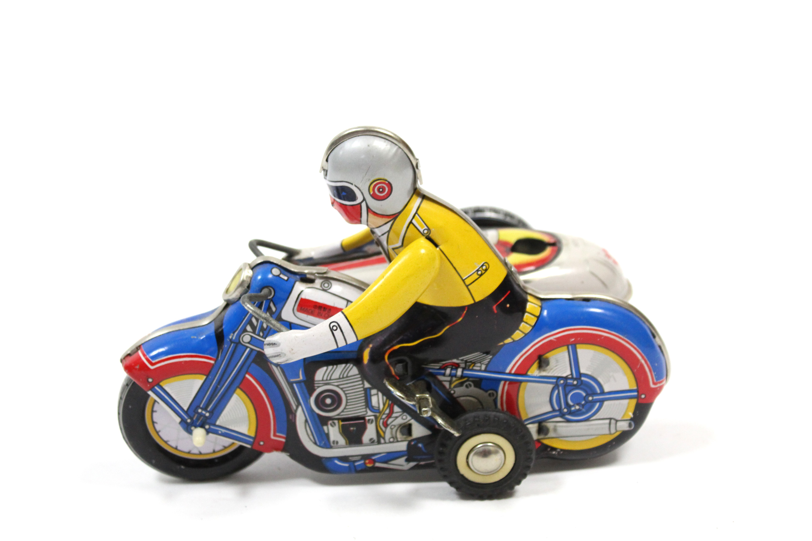 A Chinese clockwork operated lithographed tinplate toy motorcycle & sidecar, unboxed.