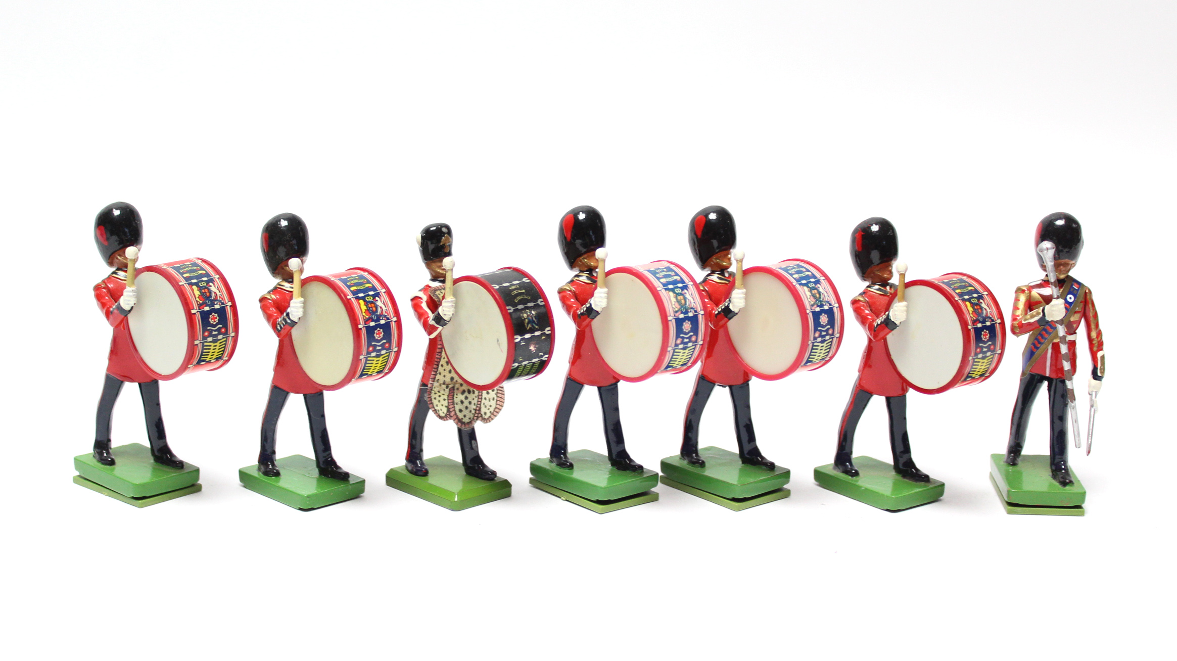 Seven painted metal Scots Guard bandsmen figures, unboxed.