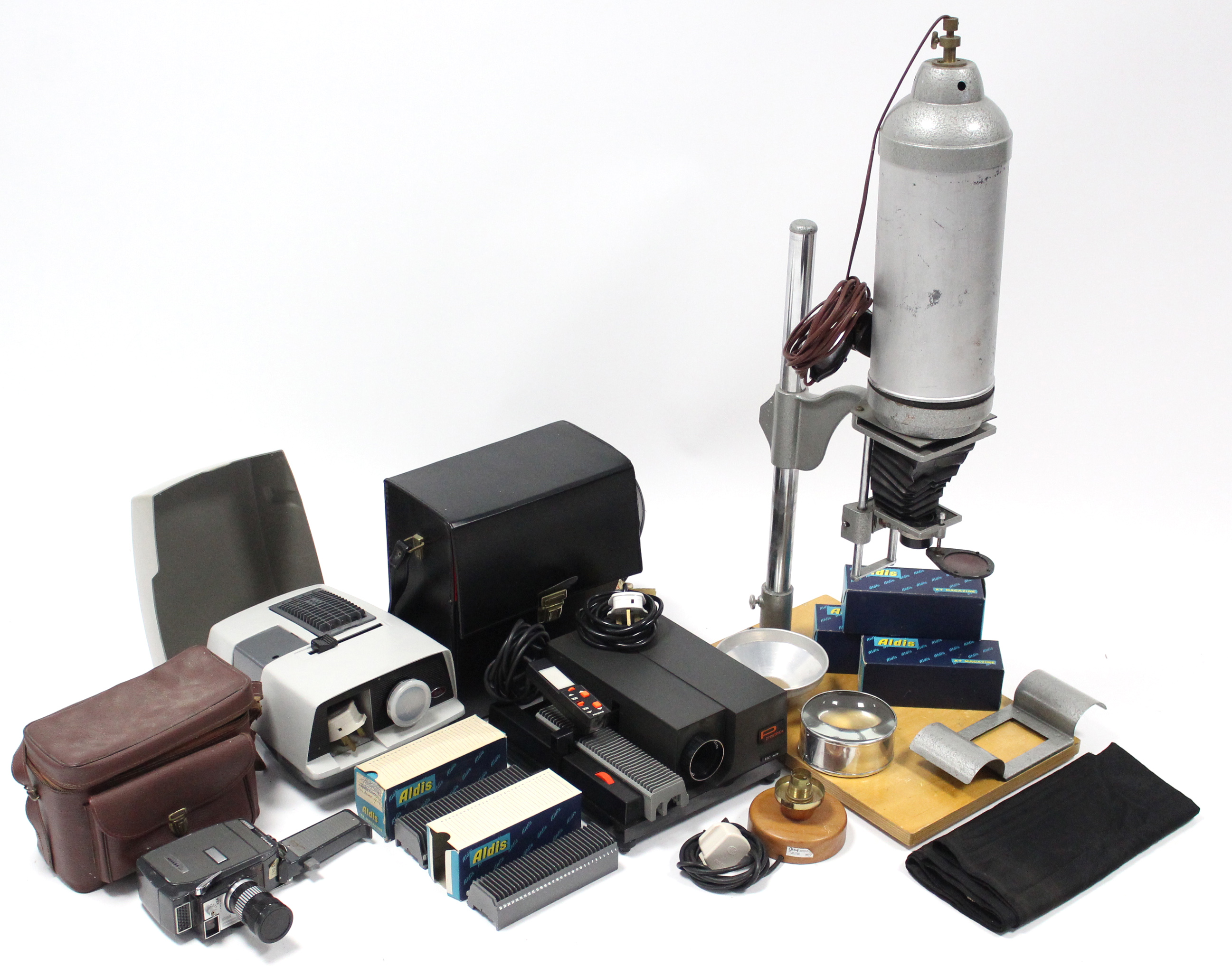 A Vernon “V-8 Zoom” cine camera; a Prestinox slide projector, both cased; a dark-room enlarger,