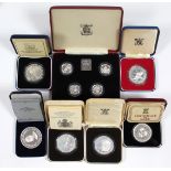 A set of four sterling silver proof £1 coins, 1984-1987, cased; a 1977 Silver Jubilee sterling