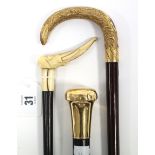 A late 19th/early 20th century ladies walking cane with carved ivory elephant-heads handle, 34”