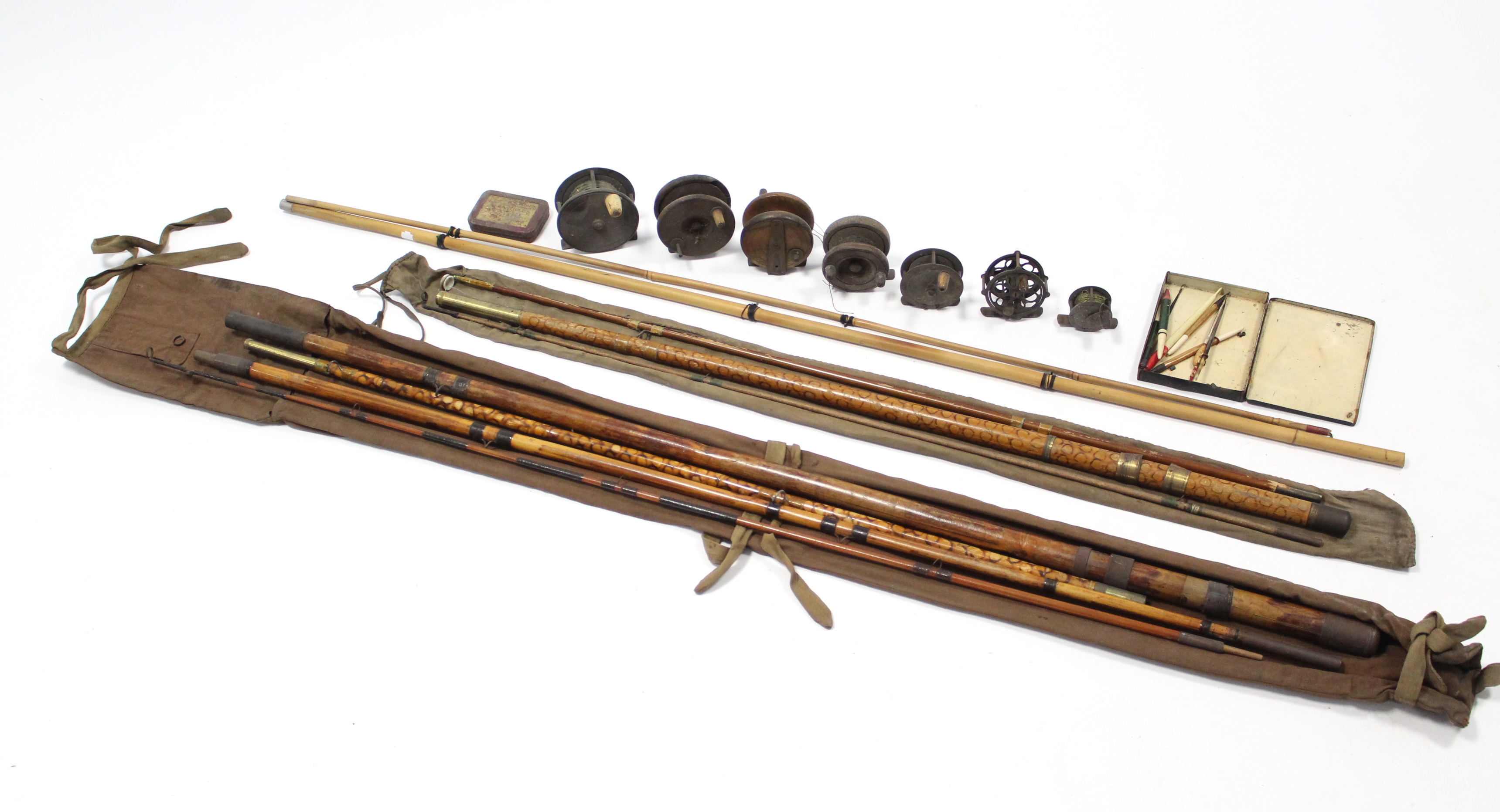 Two cane fly-fishing rods; seven various fishing reels; & two tins of fishing lures.