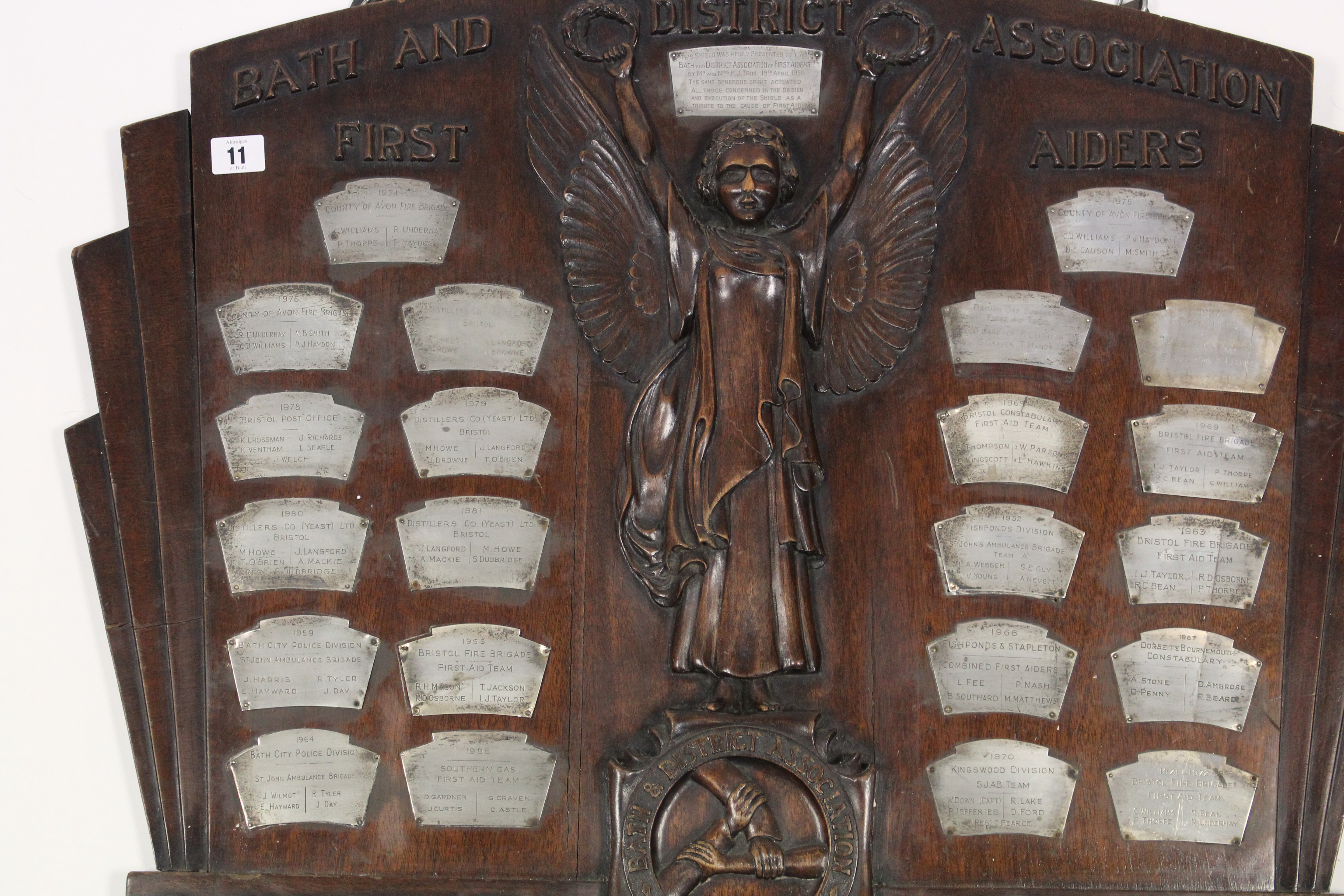 A “BATH AND DISTRICT ASSOCIATION FIRST AIDERS” CARVED WALNUT “GOODWILL SHIELD” BEARS TWENTY-THREE - Image 2 of 3