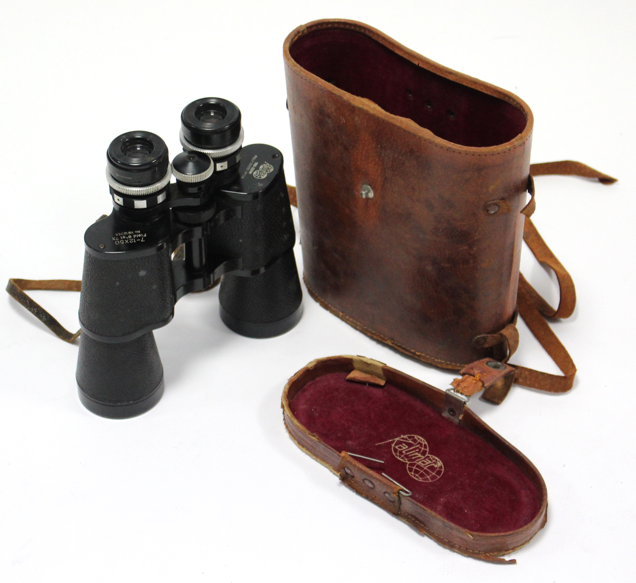 A pair of Kalimar Tru-Zoom 7-12 x 50mm filed glasses with leather case.