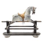 A LATE 19th / EARLY 20th century DAPPLE GREY PAINTED WOODEN ROCKING HORSE (previously from a