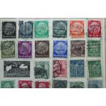 A collection of GB & foreign stamps in one small album & one small stock book.