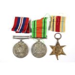A group of three Second World War service medals:- Africa Star; Defence Medal; & British War
