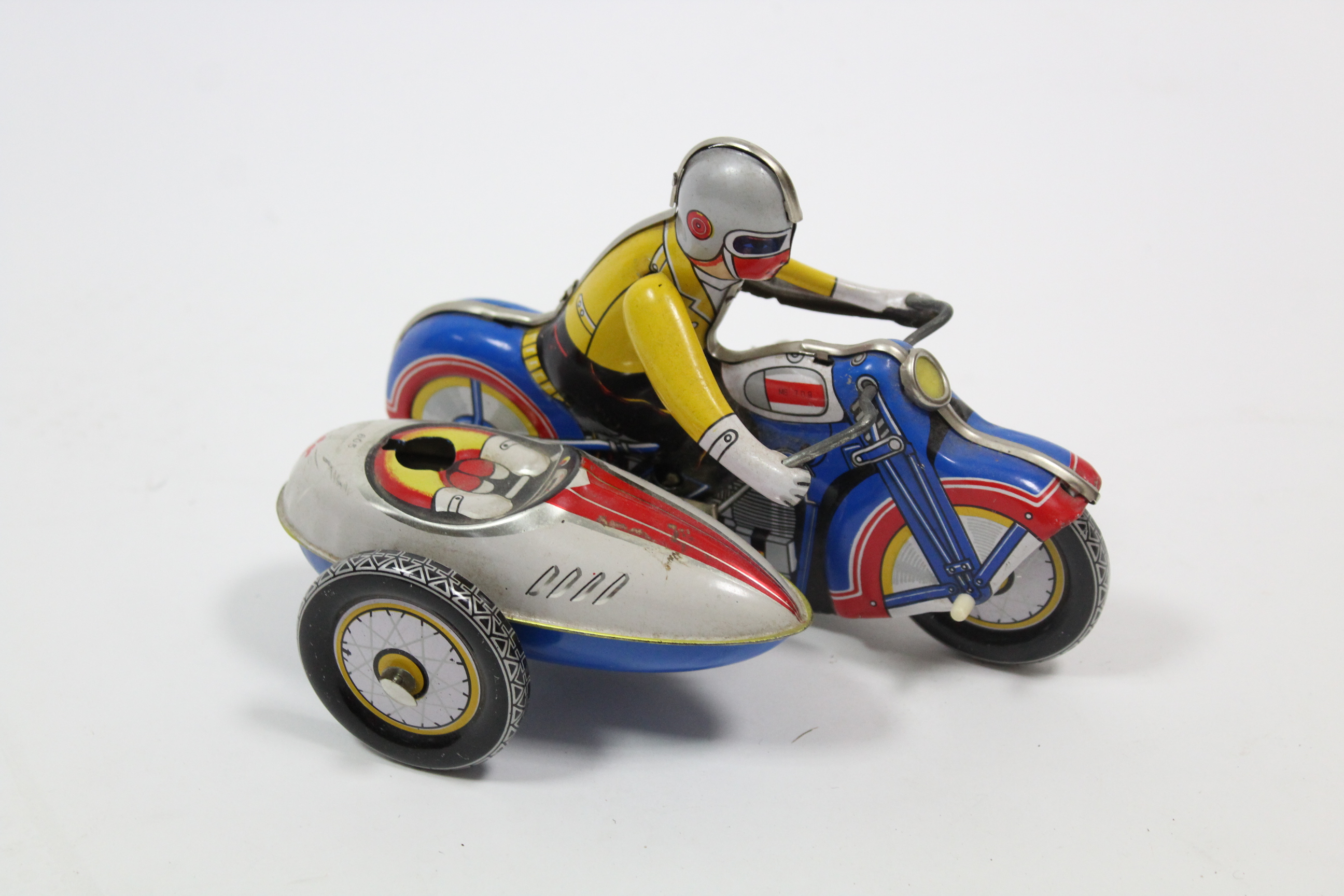 A Chinese clockwork operated lithographed tinplate toy motorcycle & sidecar, unboxed. - Image 2 of 4