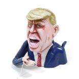 A modern painted cast-iron 'Donald Trump' novelty money box, 6¾” high.