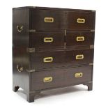 A reproduction mahogany secretaire campaign chest with fitted interior enclosed by hinged fall-front