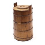 A wooden milk churn of round tapered form, 31” high