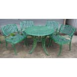 A green painted aluminium garden table, with pierced circular top & on four shaped legs, 36”