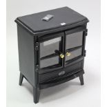 A Dimplex coal-effect electric fire in black-finish case, 17½” wide, with remote control, & a