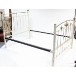 A Victorian-style white painted iron & brass 4’ 6” bedstead, complete with side rails.