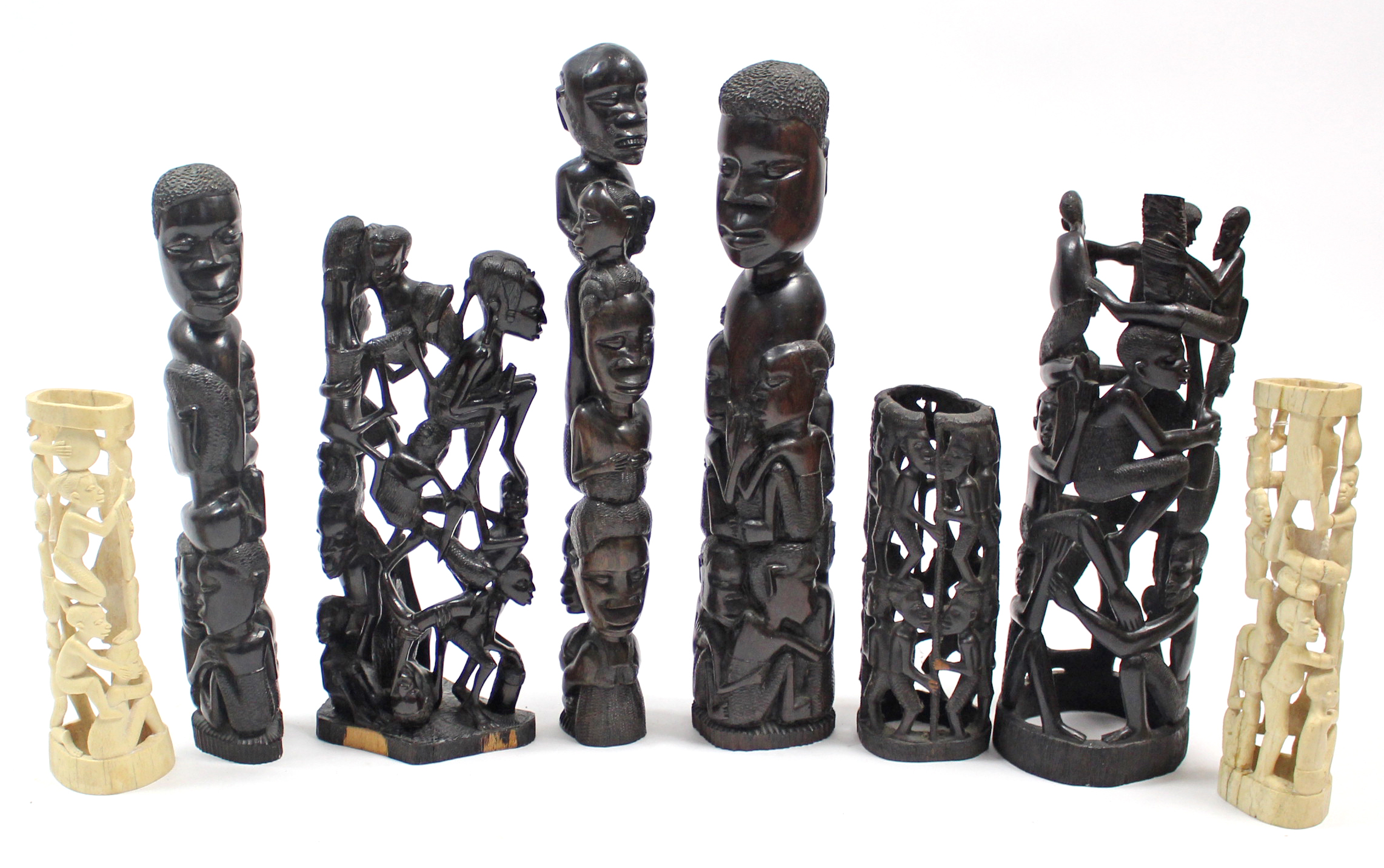 Two African carved bone figural ornaments, 11”, & 10½” high; & six various African carved hardwood