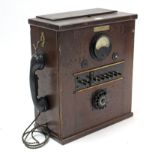 An early/mid-20th century De Te We (German) telephone switchboard in wooden case, 16¾” x 19½”;