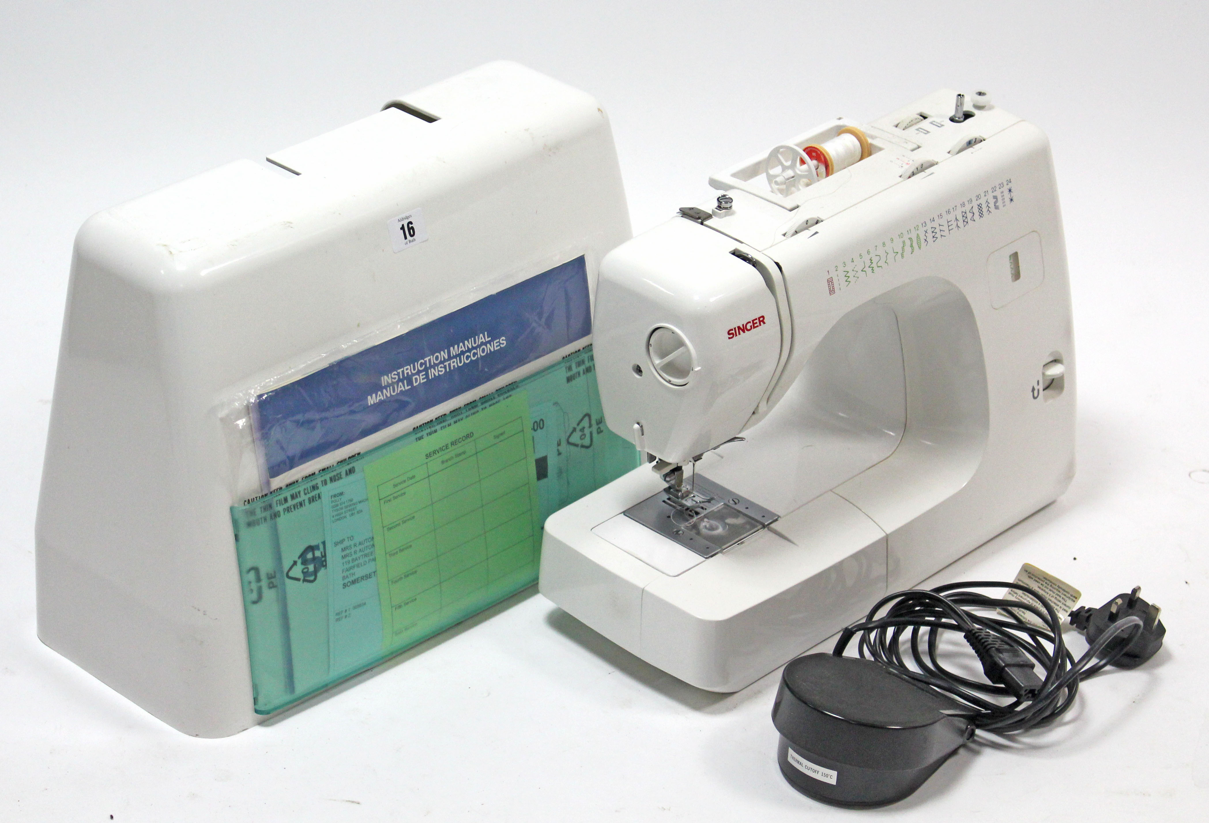 A Singer electric sewing machine, with case.