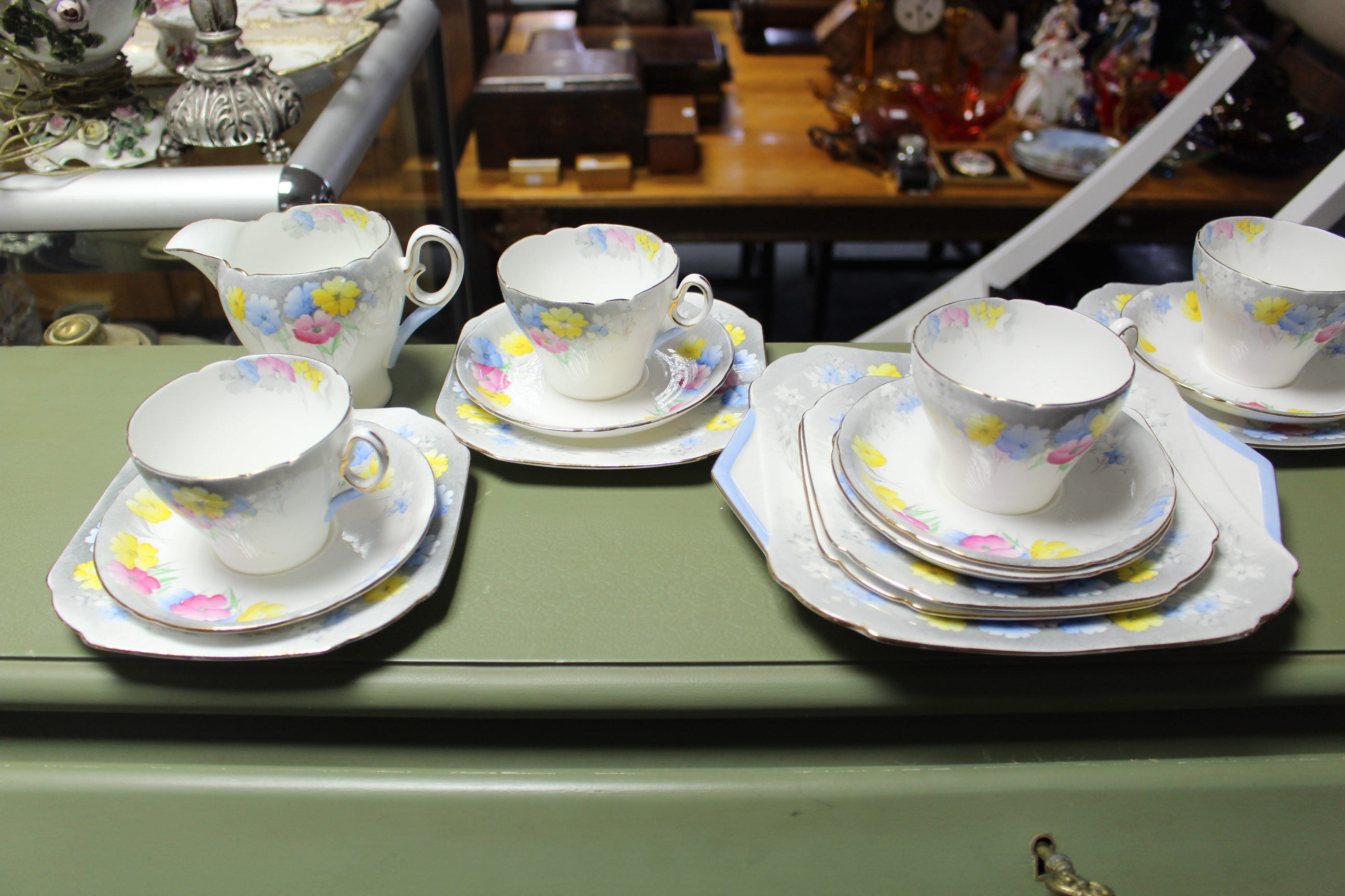 A Shelley bone china floral decorated twenty-one piece tea service (settings four six); together
