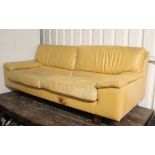 A Tetrad tan leather three-seater settee with loose cushions to seat, & on short square legs, 76”