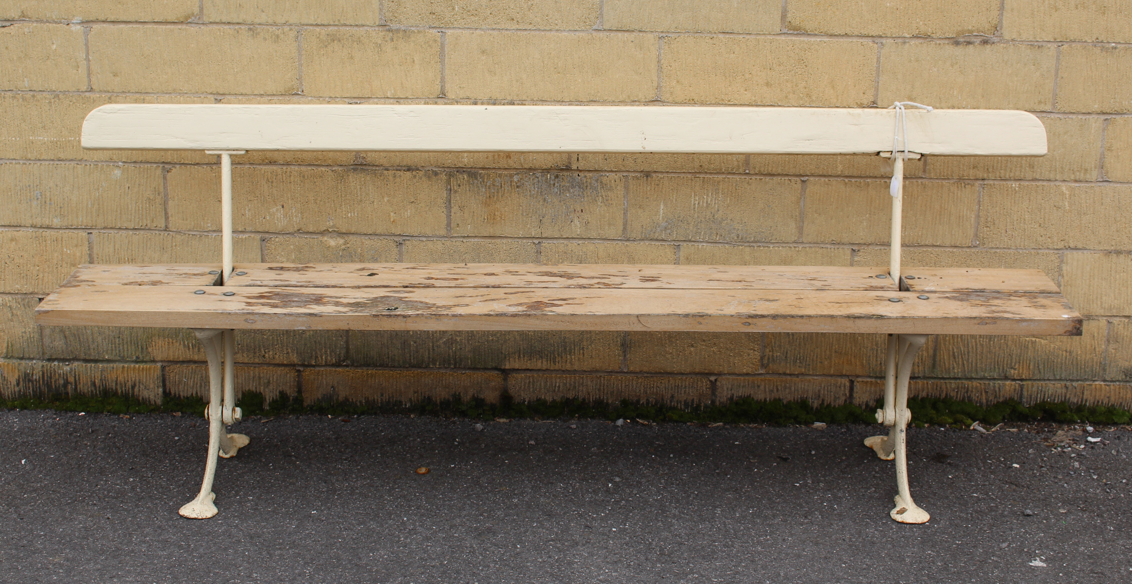 An early/mid-20th century white painted wooden & cast-iron tram bench on X-shaped end supports, 78¾”