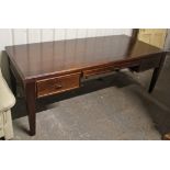 A mahogany-finish large kneehole writing table with moulded edge to the rectangular top, fitted