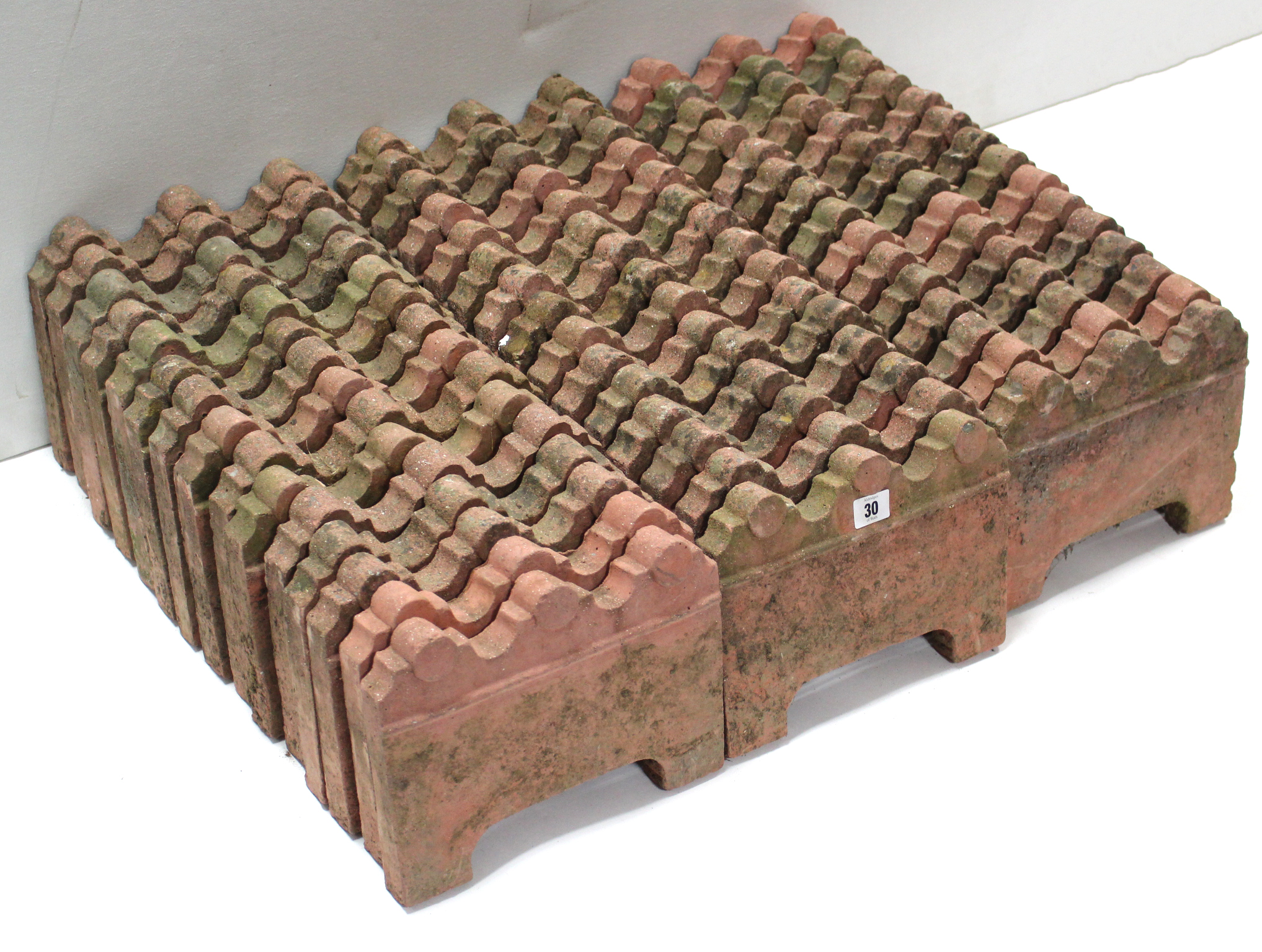 A set of forty-six terracotta-coloured edging tiles, 10¼” wide x 8” high. - Image 2 of 2