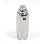 A modern chrome-plated cocktail shaker, 8¼” high.