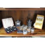 Three silver napkin rings; four plated ditto; two silver plated tea caddies; various items of plated