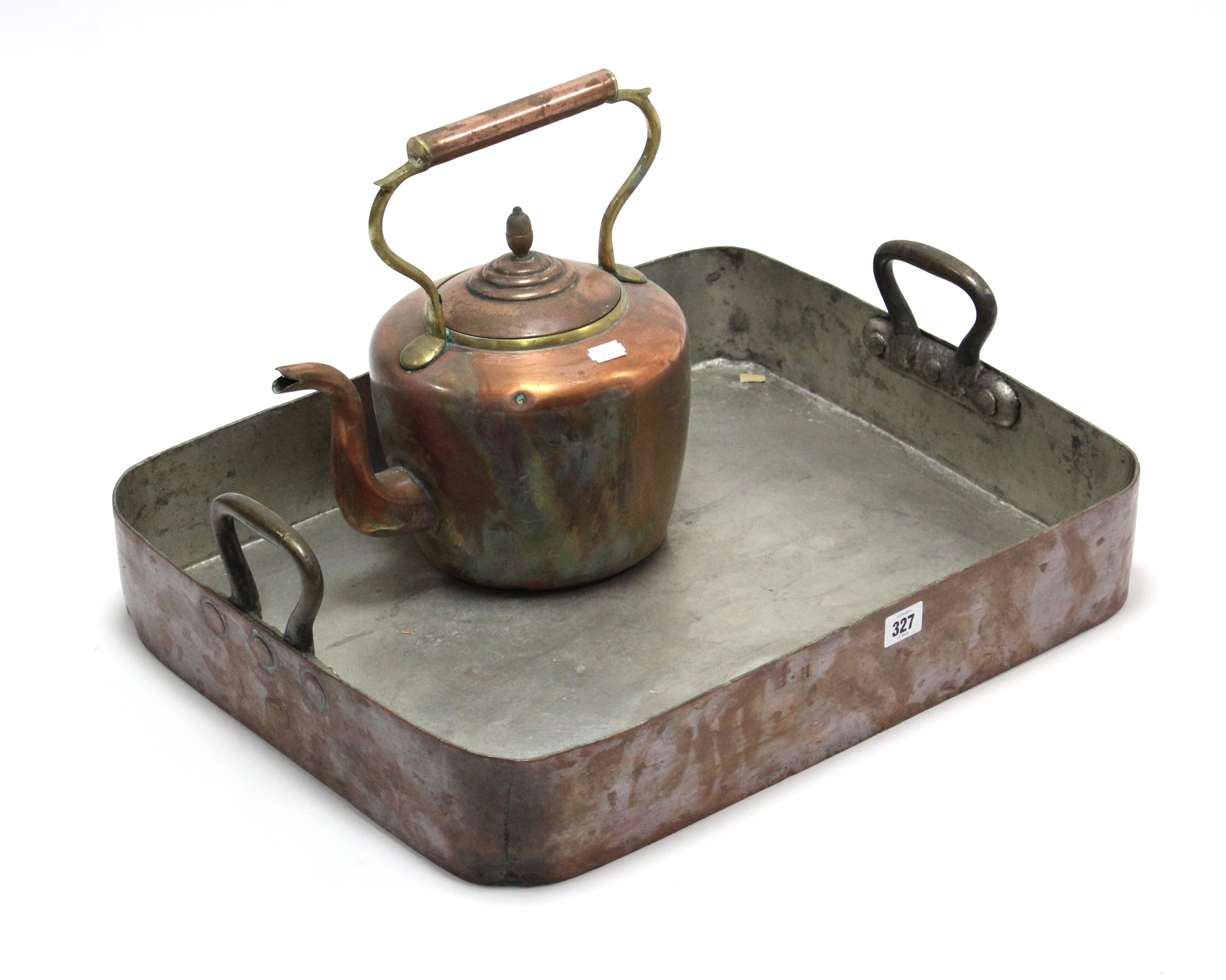 A 19th century copper rectangular two-handled baking tray, 22” x 17¾”; & a copper circular kettle,