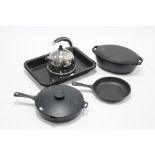 An Aga kettle; a ditto casserole dish; two ditto frying pans; & four cooking trays.