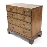 A walnut & oak chest, fitted two short & three long graduated drawers with brass swan-neck