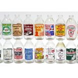 Thirty-four various advertising milk bottles.